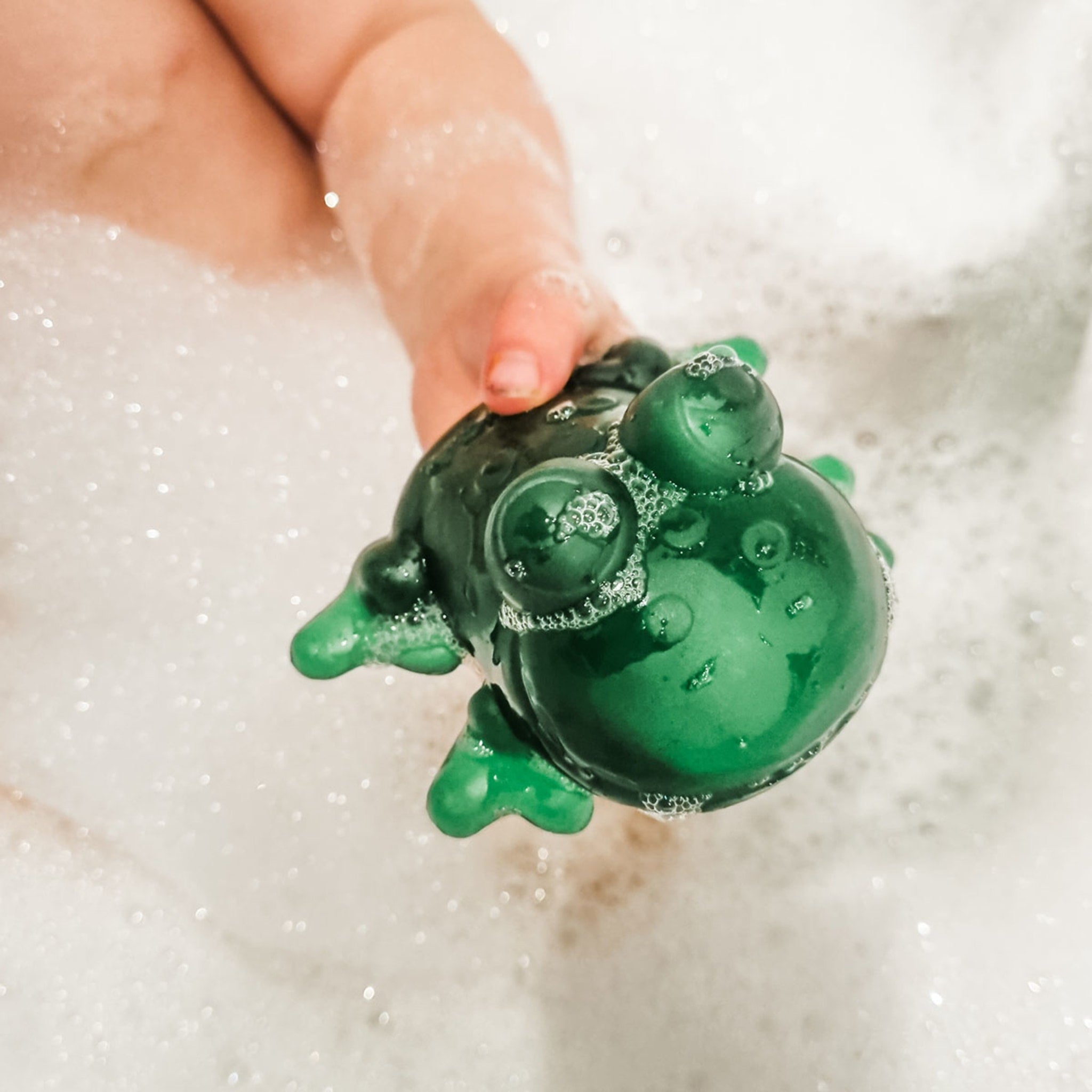 https://heveaplanet.com/cdn/shop/products/fred_the_frog_bath_toy_6.jpg?v=1679948661